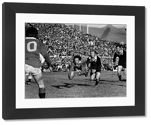 Gareth Edwards passes to Barry John during the second Lions test against the All Blacks in 1971 (crop)