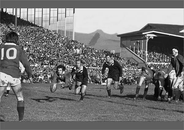 Gareth Edwards passes to Barry John during the second Lions test against the All Blacks in 1971