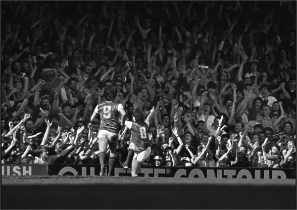 Arsenals Charlie Nicholas celebrates in front of the North Bank