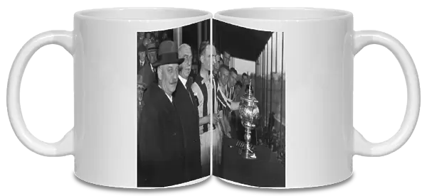 William Cuff presents WBA reserve captain Bob Finch with the Central League trophy in 1933