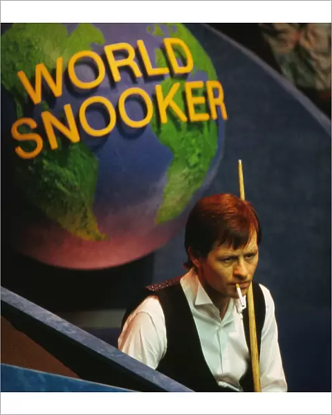 Alex Higgins has a cigarette at the 1987 Embassy World Snooker Championship