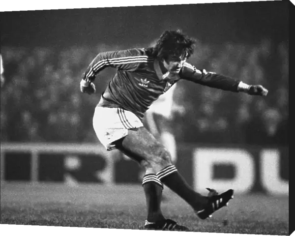 George Best plays the ball while appearing for Ipswich Town in 1979