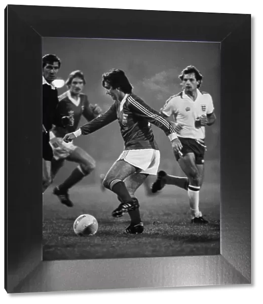 George Best on the ball for Ipswich while Englands Ray Wilkins looks on