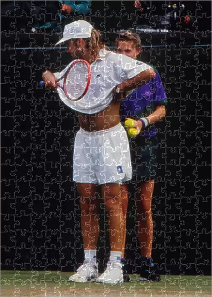 Andre Agassi jokes with a ball girl - 1992 Wimbledon Championships
