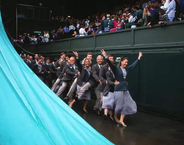Wimbledon officials do the conga during a rain break on Centre Court in 1992