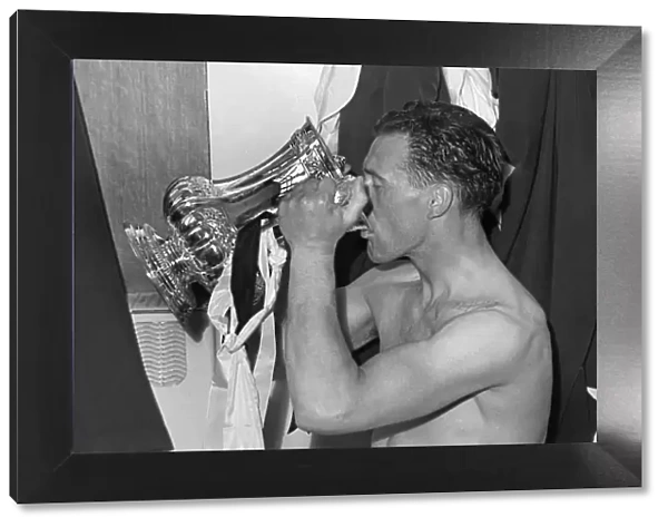 Nat Lofthouse drinks from the trophy after the 1958 FA Cup Final