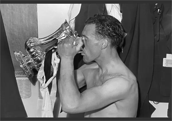 Nat Lofthouse drinks from the trophy after the 1958 FA Cup Final