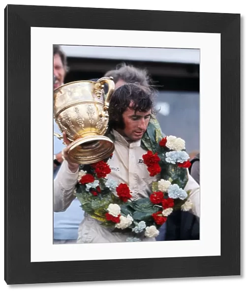 Jackie Stewart with the trophy after winning the 1969 British Grand Prix
