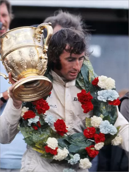 Jackie Stewart with the trophy after winning the 1969 British Grand Prix
