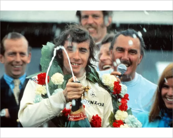 Jackie Stewart celebrates winning the 1969 British Grand Prix