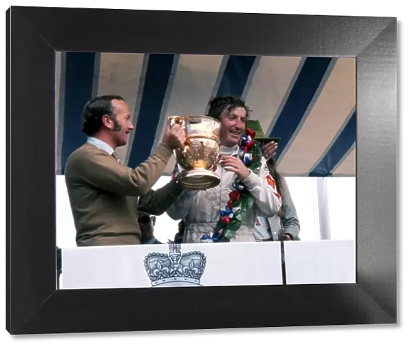 Jochen Rindt is awarded the trophy after winning the 1970 British Grand Prix