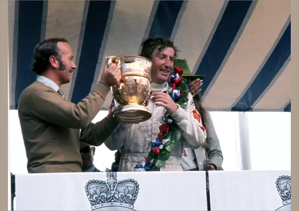 Jochen Rindt is awarded the trophy after winning the 1970 British Grand Prix