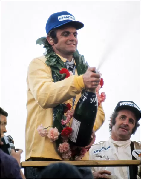 Peter Revson celebrates after winning the 1973 British Grand Prix