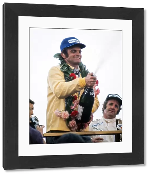 Peter Revson celebrates after winning the 1973 British Grand Prix