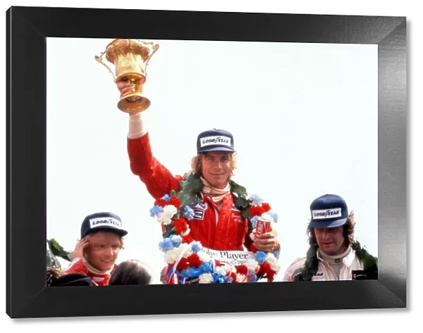 James Hunt lifts the trophy after winning the 1976 British Grand Prix