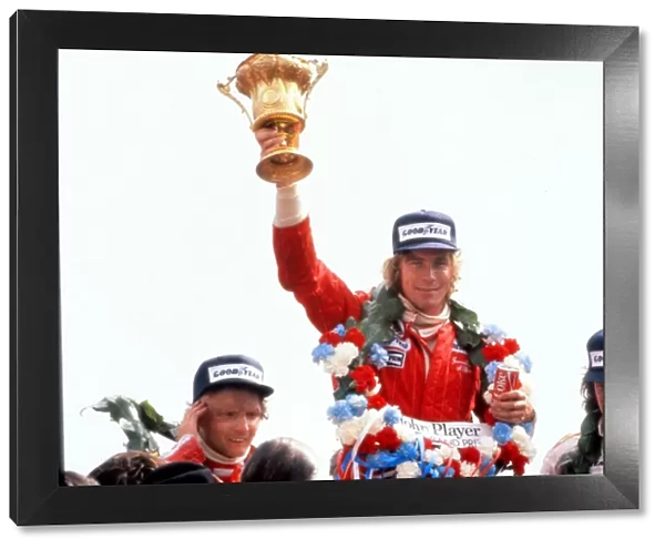 James Hunt lifts the trophy after winning the 1976 British Grand Prix