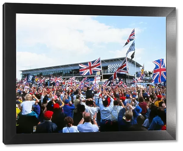 + The home fans celebrate Nigel Mansells win at the 1992 British Grand Prix
