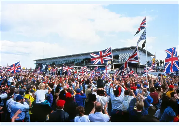 + The home fans celebrate Nigel Mansells win at the 1992 British Grand Prix