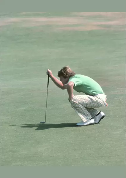 Tom Watson lines up a putt on the final day of the 1977 Open