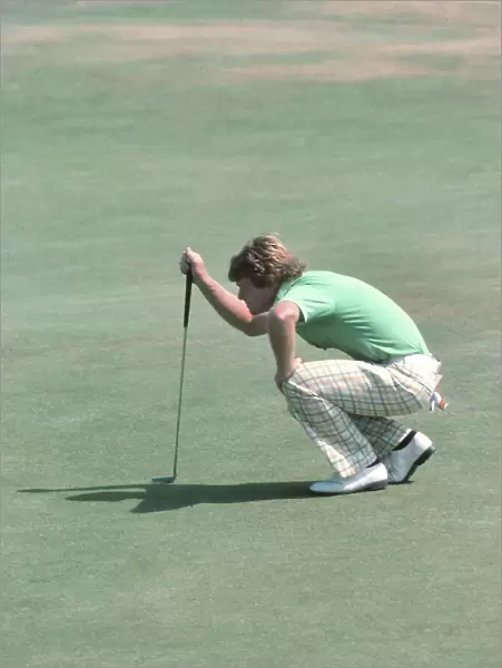Tom Watson lines up a putt on the final day of the 1977 Open