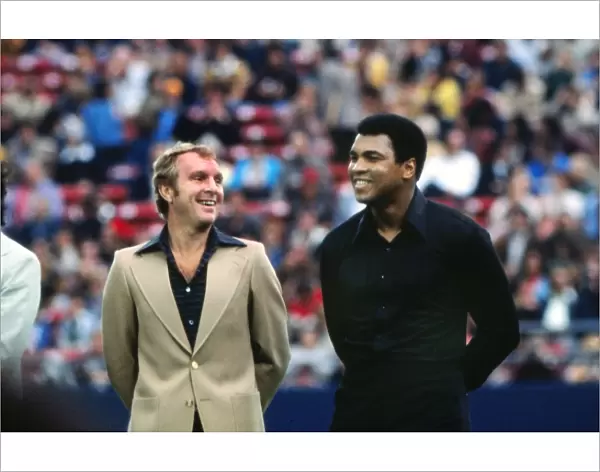 Bobby Moore and Muhammad Ali share a joke at Peles farewell game