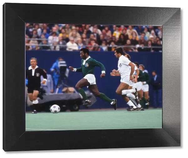 Pele dribbles with the ball during his farewell game