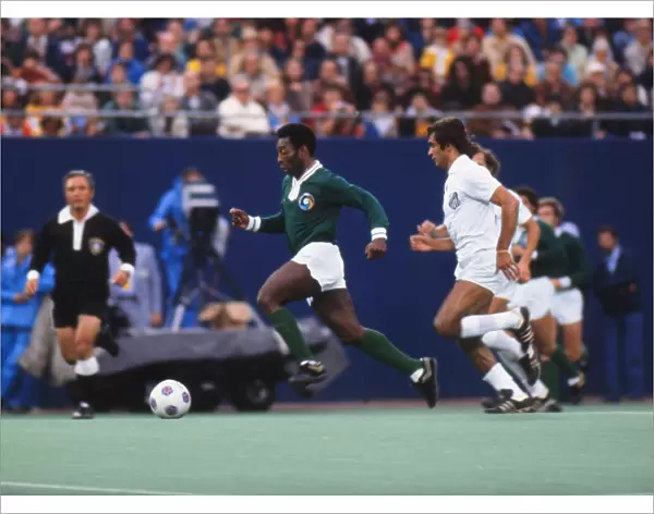 Pele dribbles with the ball during his farewell game