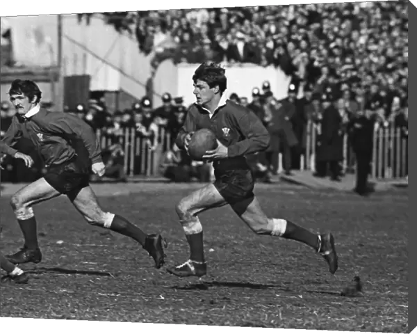 Barry John on the run with Gerald Davies in support - 1969 Five Nations
