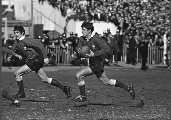 Barry John on the run with Gerald Davies in support - 1969 Five Nations