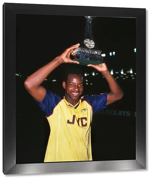 Michael Thomas celebrates with the league trophy after winning the 1988  /  9 title