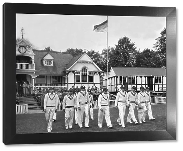The 1946 All India Team walk onto the field