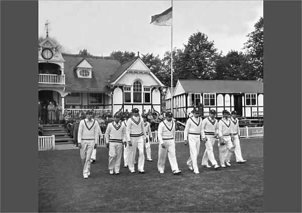 The 1946 All India Team walk onto the field
