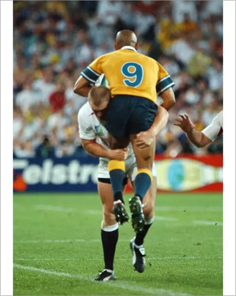 Mike Tindall dump tackles George Gregan during the 2003 World Cup Final