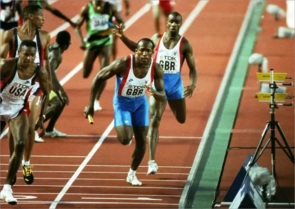 Derek Redmond hands over to John Regis during the 1991 World Championship 4 X 400m relay final