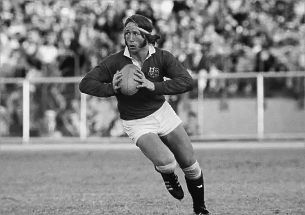 JPR Williams runs with the ball for the British Lions