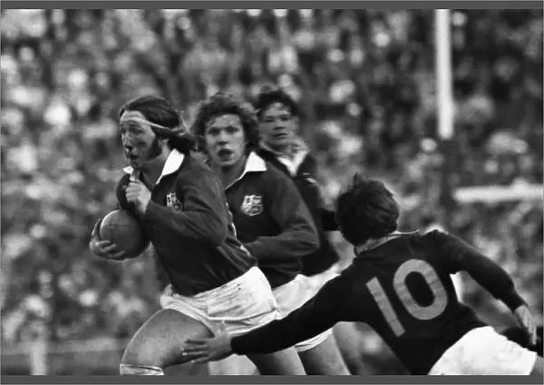 A bloody JPR Williams makes a break for the British Lions
