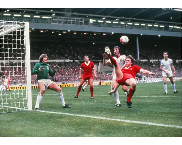 Kenny Dalglish attempts to keep the ball in play