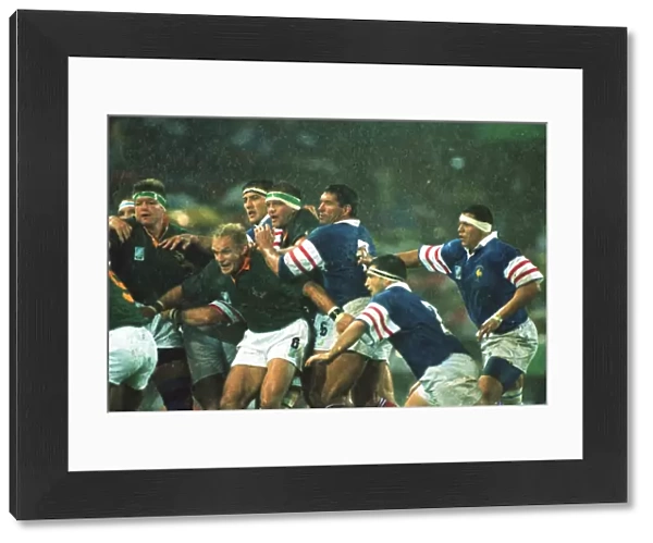 Francois Pienaar holds the line in the rain at the 1995 Rugby World Cup semi-final