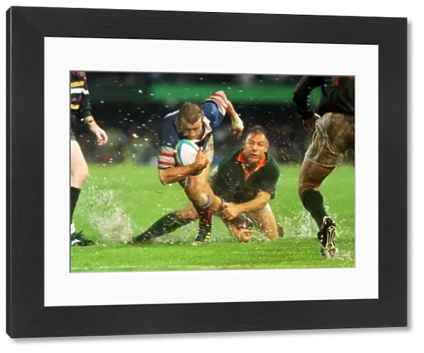 Fabien Galthie attempts to make a break in the rain-soaked 1995 Rugby World Cup semi-final