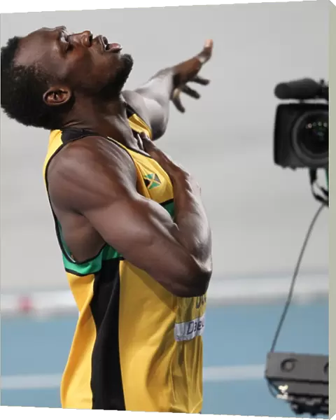 Usain Bolt plays to the cameras after winning 200m Gold at the 2011 World Championships