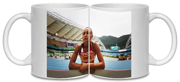 Jess Ennis takes instructions from her coach during the 2011 World Championship