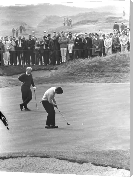 Tony Jacklin putts while Jack Nicklaus looks on during their famous 1969 Ryder Cup singles match