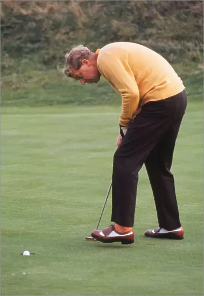 Bernard Hunt sinks a putt during the 1969 Ryder Cup