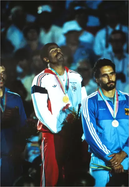 Daley Thompson enjoys himsef on the podium after winning his second Olympic gold medal