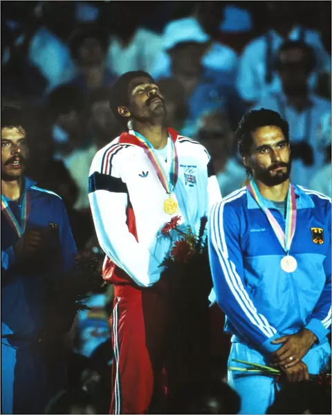 Daley Thompson enjoys himsef on the podium after winning his second Olympic gold medal