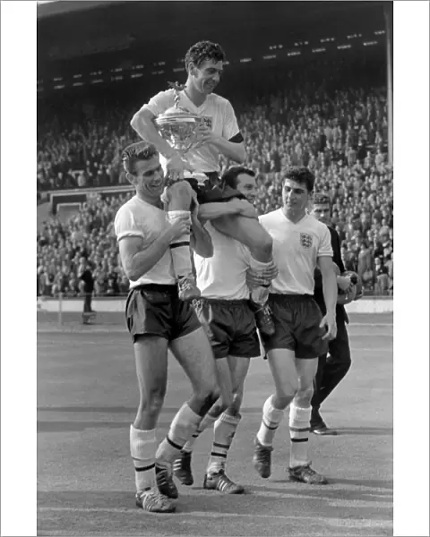 Johnny Haynes is carried by his teammates after England beat Scotland 9-3 at Wembley in 1961