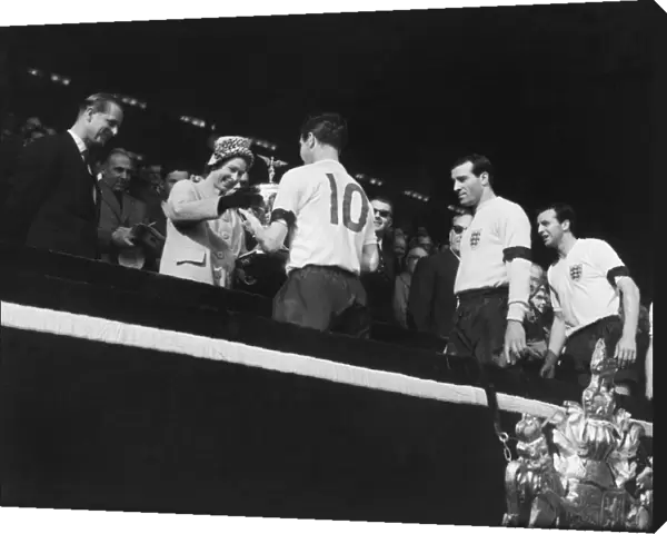 England captain Johnny Haynes receives the Home Internationa Trophy from the Queen after Englands 9-3 win over Scotland in 1961