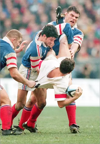 Austin Healey is tackled by Marc Lievremont in the 1998 Six Nations