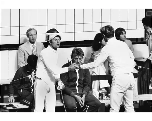 Jim Fox reluctantly shakes hands with Boris Onishchenko after their infamous fencing bout at the 1976 Montreal Olympics
