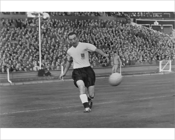 Stanley Matthews crosses the ball for England against Wales in 1956